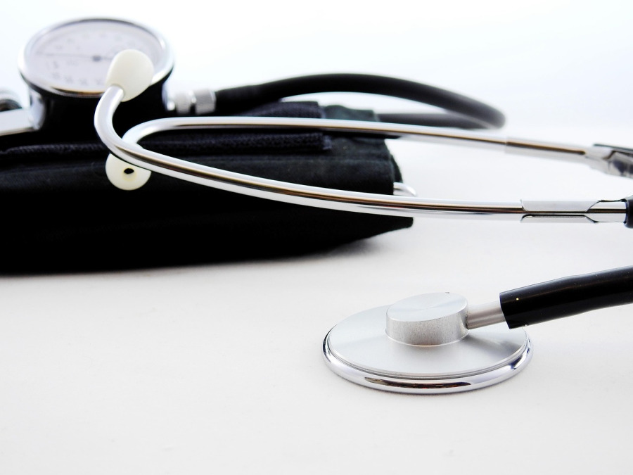 home care nurse taking senior's blood pressure at home