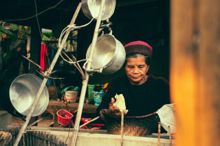 nurse preparing meal with senior at home